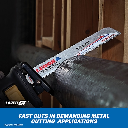 LENOX 2014212 thick metal reciprocating saw blade cutting pipe, close-up of blade teeth and branding.