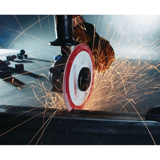 LENOX 1972921 cutting disc grinding metal with sparks in action, close-up industrial photography.