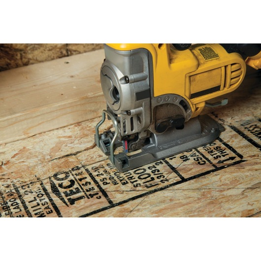LENOX 1991494 jigsaw blade cutting plywood floorboard, close-up side view.