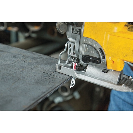 LENOX 1991595 metal cutting jigsaw blade installed in power tool cutting a steel sheet.
