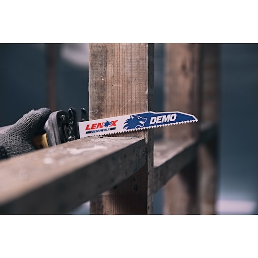LENOX DEMOWOLF reciprocating saw blade 20598966R cutting wood in construction setting, close-up view.