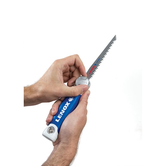 Photo of LENOX 20997TFHS618636 folding hand saw with blue handle, shown held in two hands on white background.