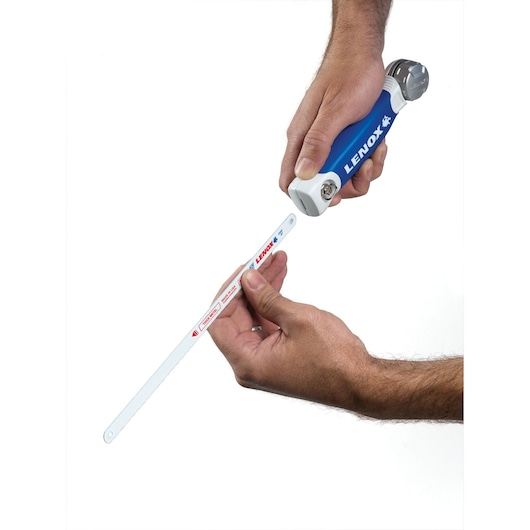 LENOX 20997TFHS618636 hacksaw handle with hands installing a saw blade, white background, product photography.
