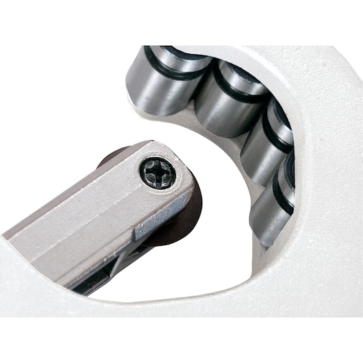 LENOX 21008TC58 close-up photo of pipe cutter wheel with silver rollers on white background.