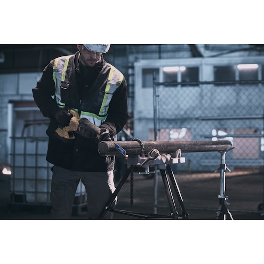 LENOX LXAR9110CT-1 reciprocating saw blade cutting metal pipe on a stand in industrial setting.