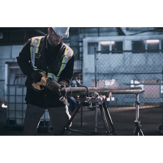 LENOX LXAR9110CT-1 reciprocating saw blade cutting metal pipe in industrial setting.