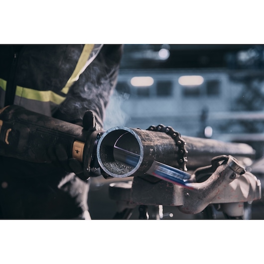 LENOX reciprocating saw blade cutting through steel pipe, close-up action view, LXAR9110CT-1.