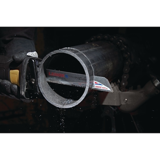 Photo of LENOX LXAR9110CT-1 reciprocating saw blade cutting a thick metal pipe.