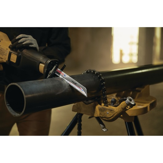 LENOX LXAR9110CT-1 reciprocating saw blade cutting metal pipe in workshop setting.