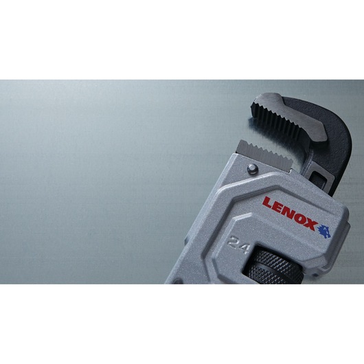 Photo of LENOX LXHT90624 pipe wrench close-up, silver and black, with visible brand name and jaw detail.
