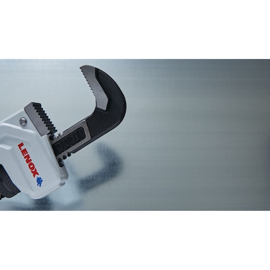 Close-up photo of LENOX adjustable wrench LXHT90714 with serrated jaws, metallic finish, on grey background.